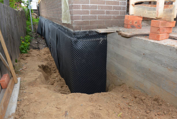 Happy homeowners after waterproofing job in Economy